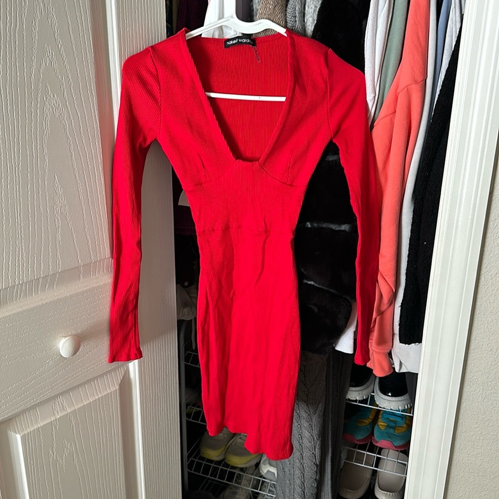Sexy red mid dress by Naked wardrobe with deep V. Body hugging!